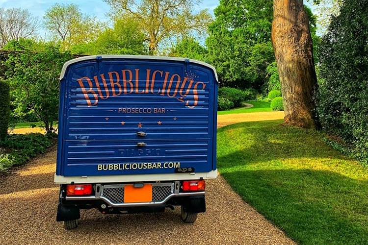 Rear panel of the customised blue Tuk Tuk with Bubblicious branded on the back