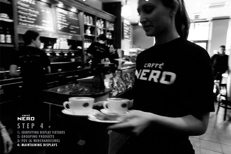 Black and white image of a woman with Caff&egrave; Nero t-shirt walking with coffee cups in her hand for Caff&egrave; Nero manual dividers