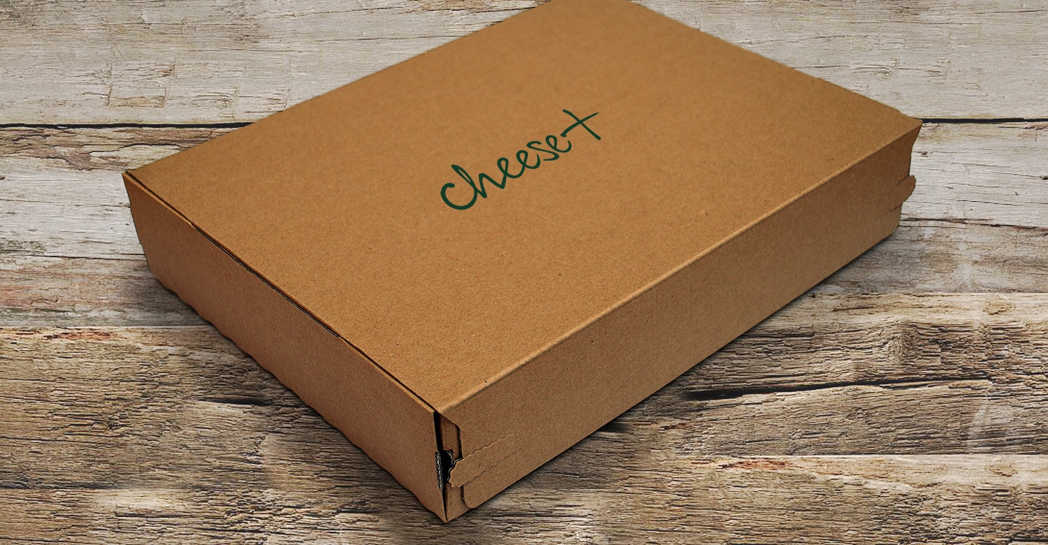 Closed box with Cheese Plus branding on top lid