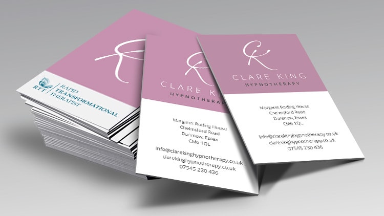 Business cards spread apart with Clare King branding