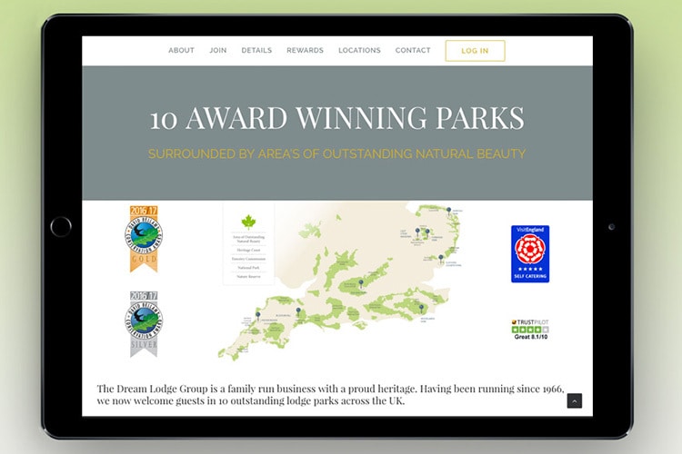 Tablet with green background displaying Responsive website design of Dream Lodge Loyalty