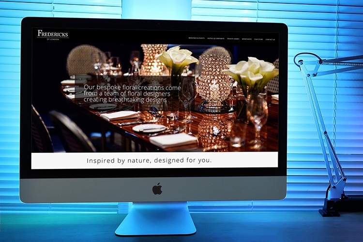 Fredericks of London Homepage Website Design Desktop with blue lit background