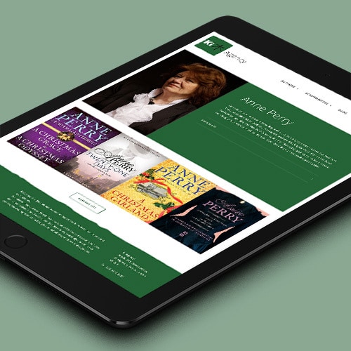 Tablet laying flat displaying home page of Ki Agency responsive website design Thumbnail