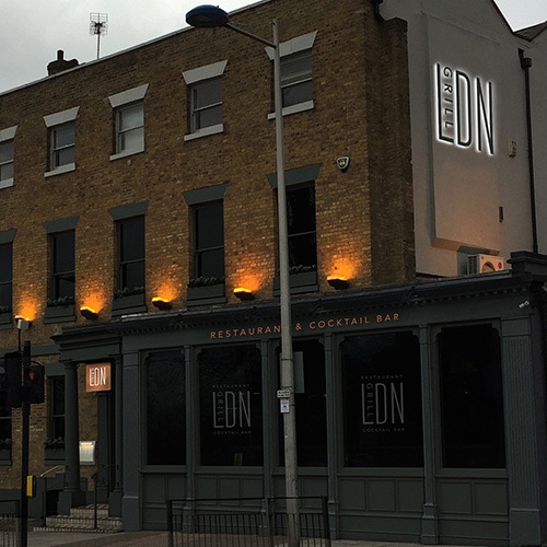 LDN grill exterior branding with an illuminated sign and projecting sign Thumbnail