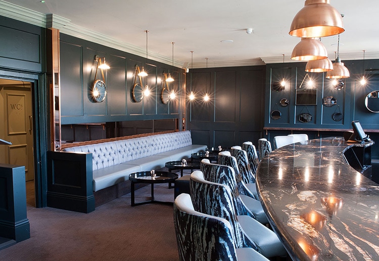 LDN Grill bar with marble table and textured stools photography
