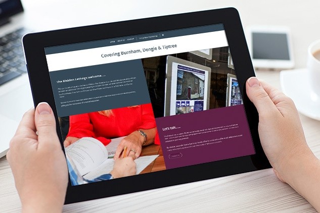 A person holding a tablet viewing the responsive Maldon Lettings website