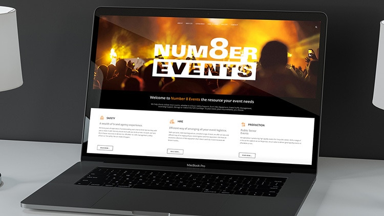 Laptop displaying the homepage of Number 8 Events website design