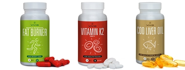 White bottles with Vivid Health labels and vitamin gels spilled photography for Vivid Health