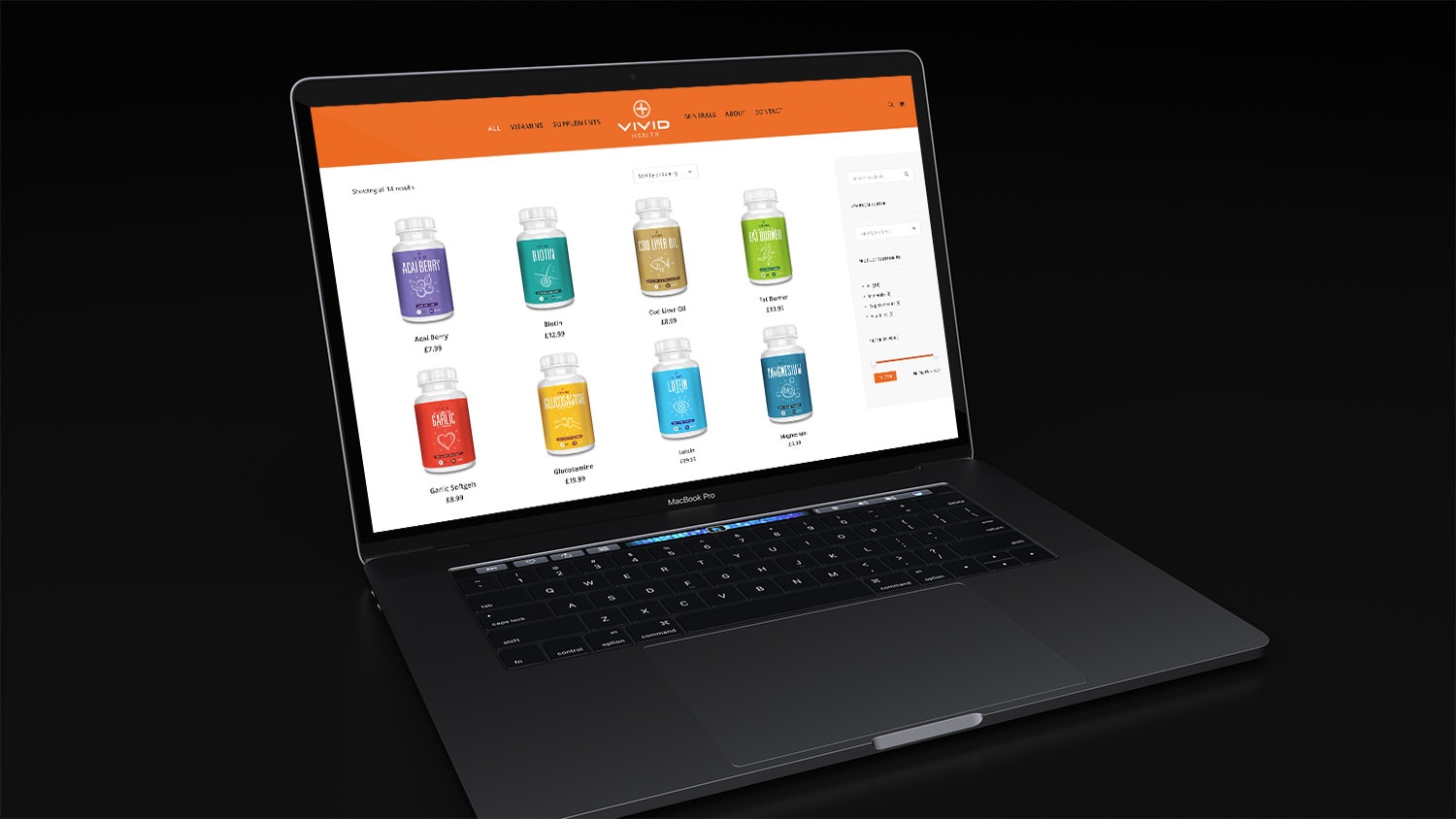 Laptop in a dark room displaying the Vivid Health responsive eCommerce shop page website