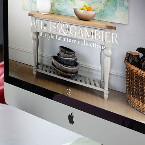 Close up of desktop displaying the Willis & Gambier website with a full bleed image of Willis & Gambier furniture Thumbnail
