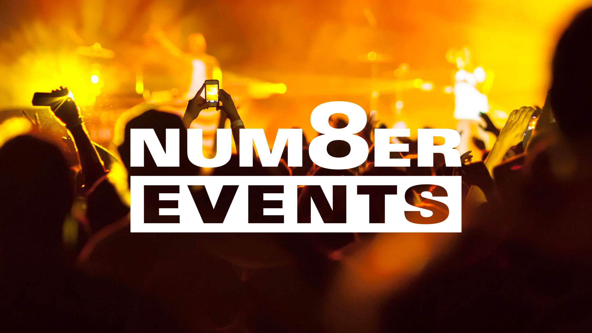 People enjoying a concert with Number 8 Events branding design