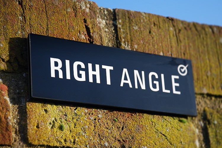 Close up of Right Angle Signage on bricks