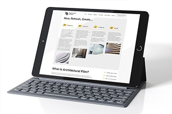 Tablet with keyboard display homepage of T6 responsive website design