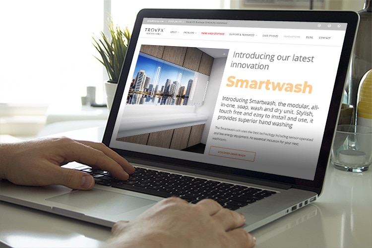Person using laptop, browsing the product page of Trovex Innovations